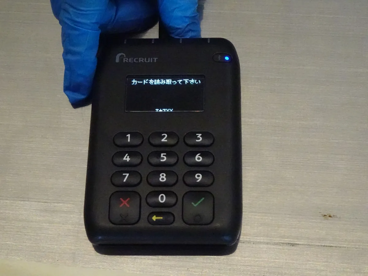 Why you spend more with a bank card than in cash 3 Contactless payment terminal in a store, central to card transactions.